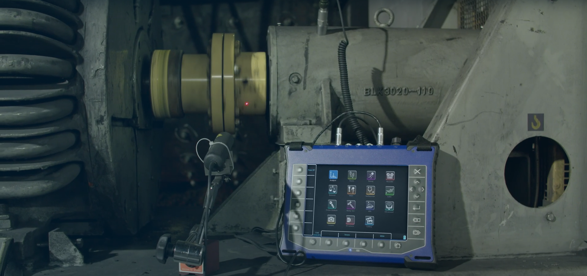 Engineer performing machinery vibration analysis
